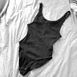 Out from under black bodysuit